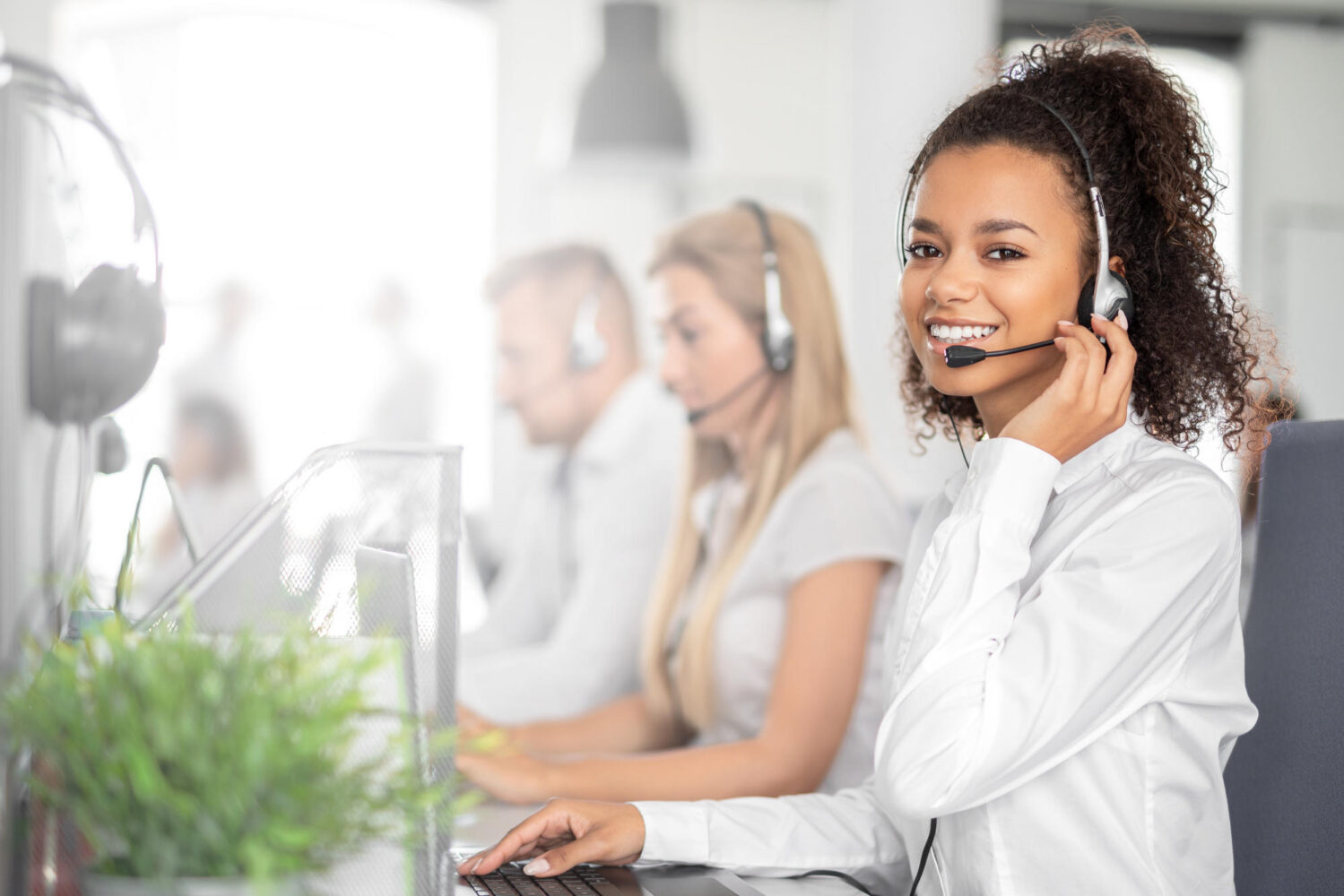 Call center worker accompanied by her team.